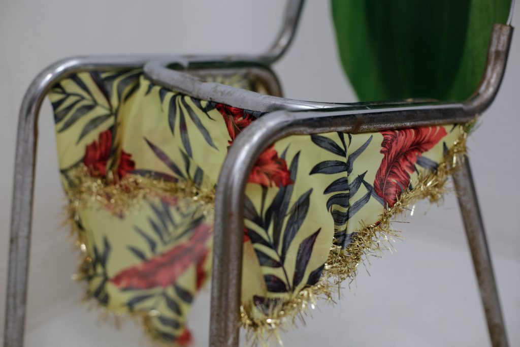 Lola Queen Supreme (detail), 2017 chair frame, fabric, tinsel, plastic ti leaves, styrofoam, comb, wire, wood blocks approx. 46” x 14” x 21”
