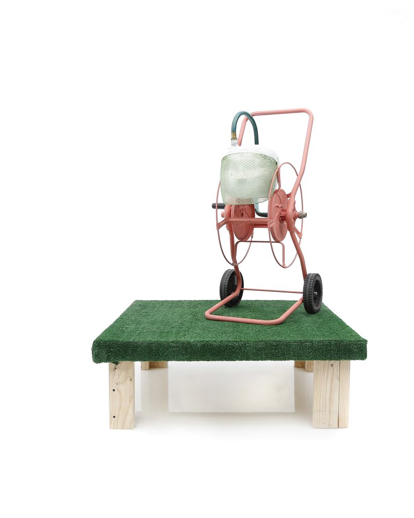 YES Machine, 2017, Hose reel, face shield, plastic mesh, foam, aqua resin, artificial grass, wood, paint